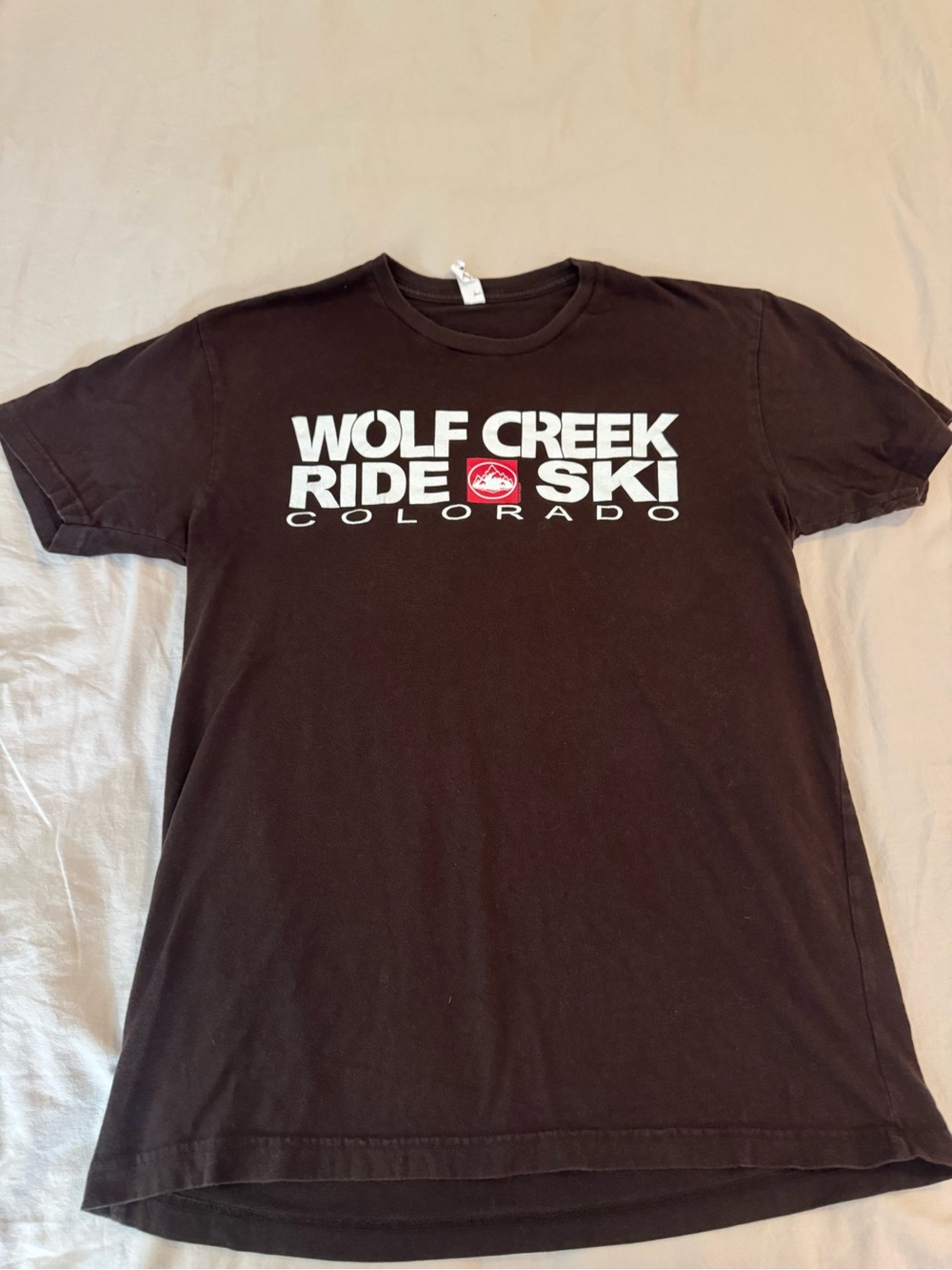 Next Level Apparel BrownTee with White Text and Red Emblem
